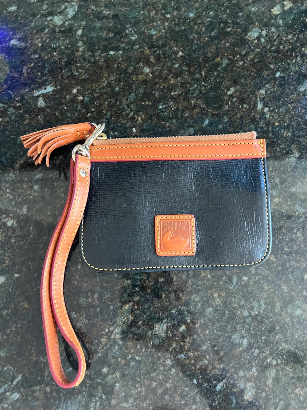 Dooney & Bourke Black and Tan Leather Wristlet with Tassel